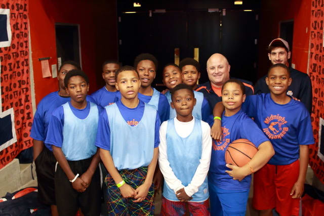 Middle Schoolers with Pastor Hollis before the halftime game!